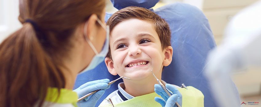 ADG-A child with a dentist in a dental office