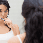 ADG-Woman brushing teeth