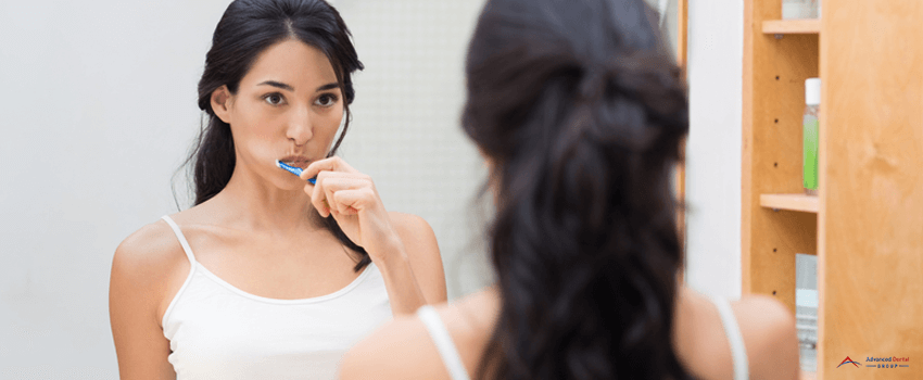 ADG-Woman brushing teeth