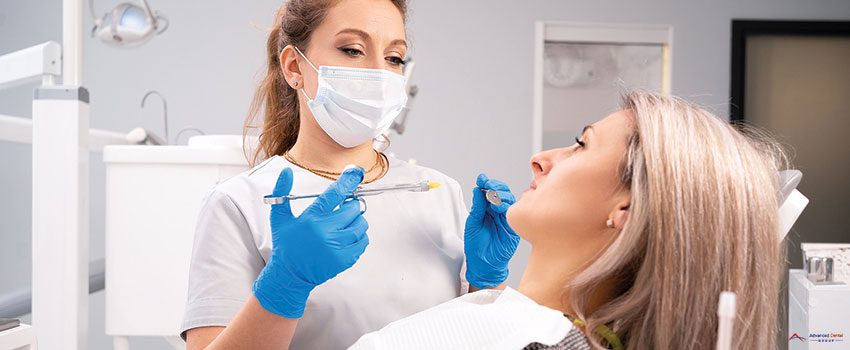 doctor-woman-holding-syringe-with-dental-anesthesia